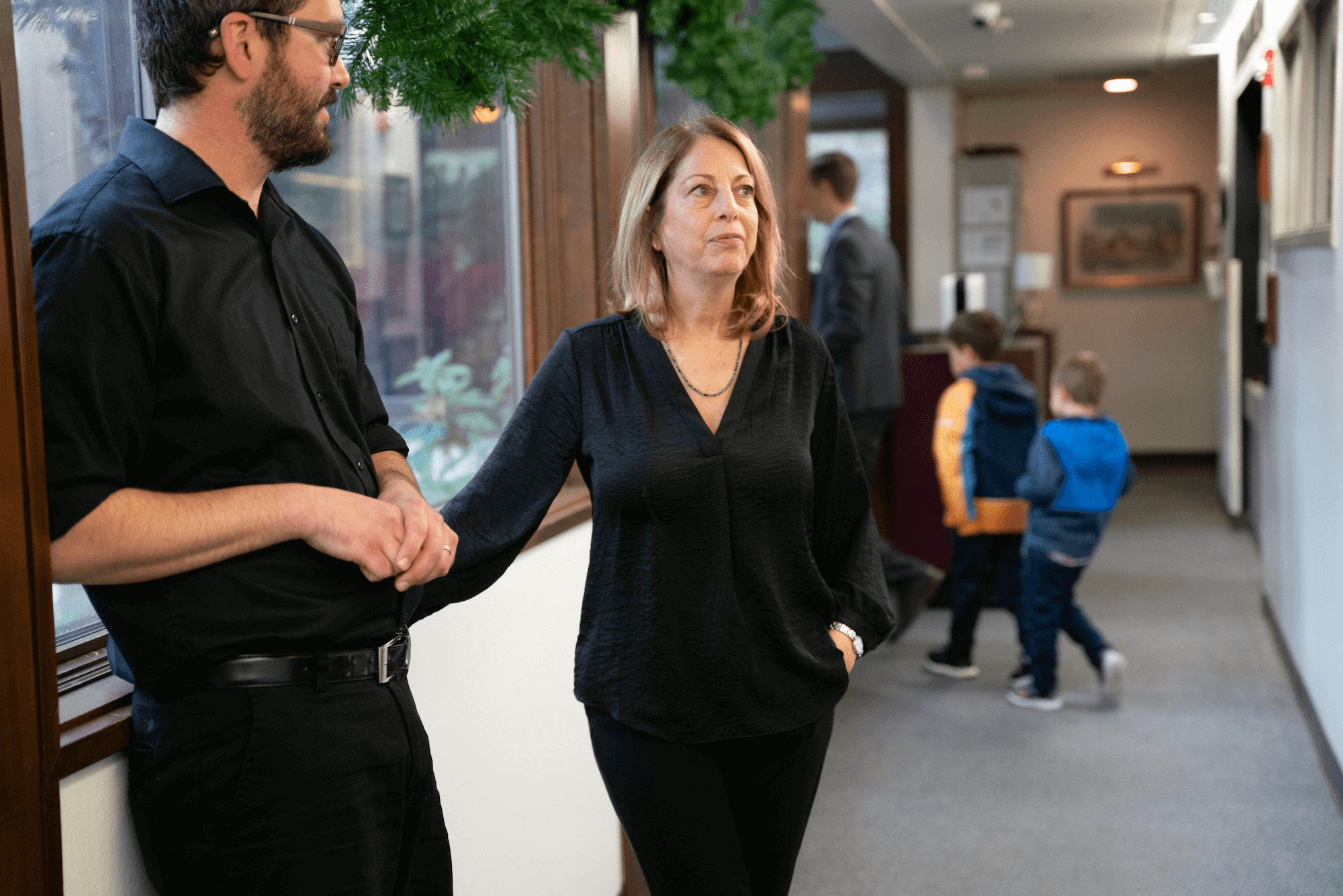 Wendy Bamonte and Jeff Wood in a hallway preparing for the performance